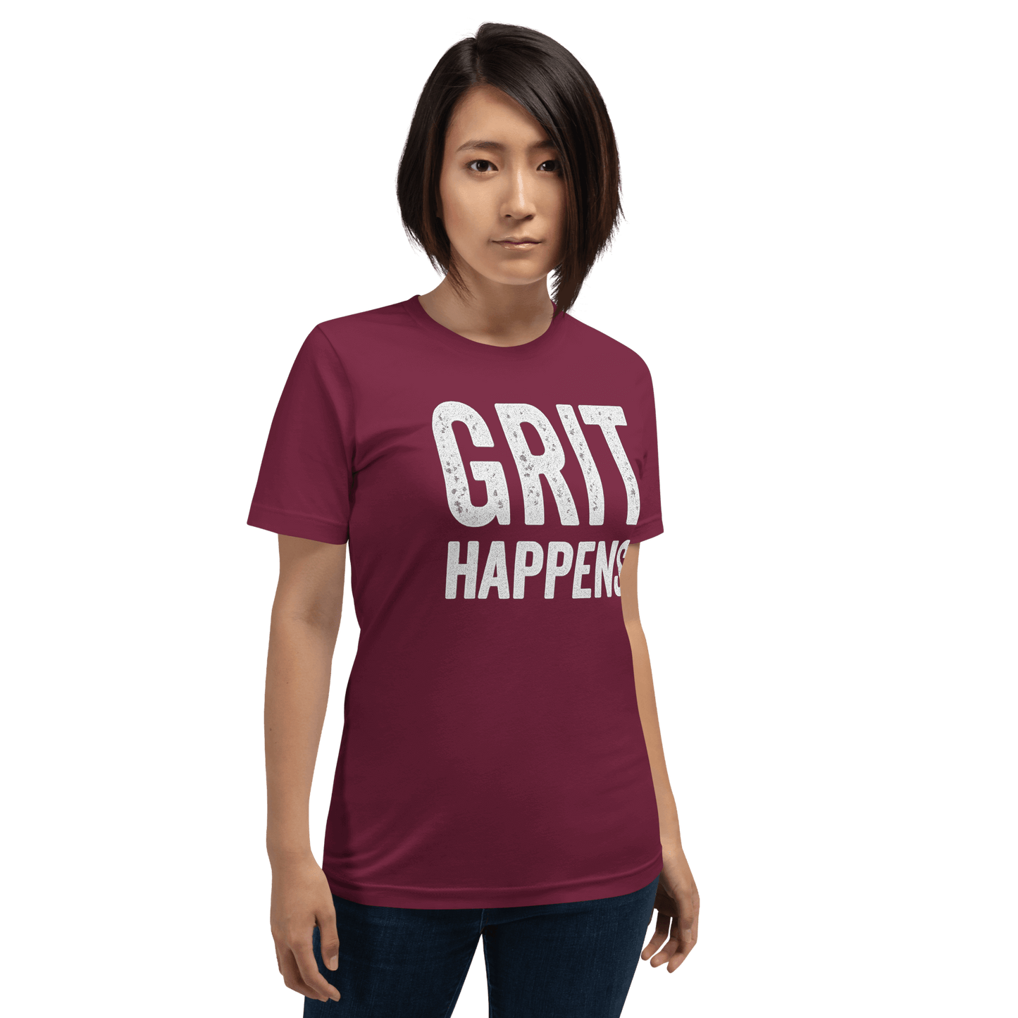 Woman stands to show the GRIT HAPPENS. unisex t-shirt in Maroon color - front veiw.