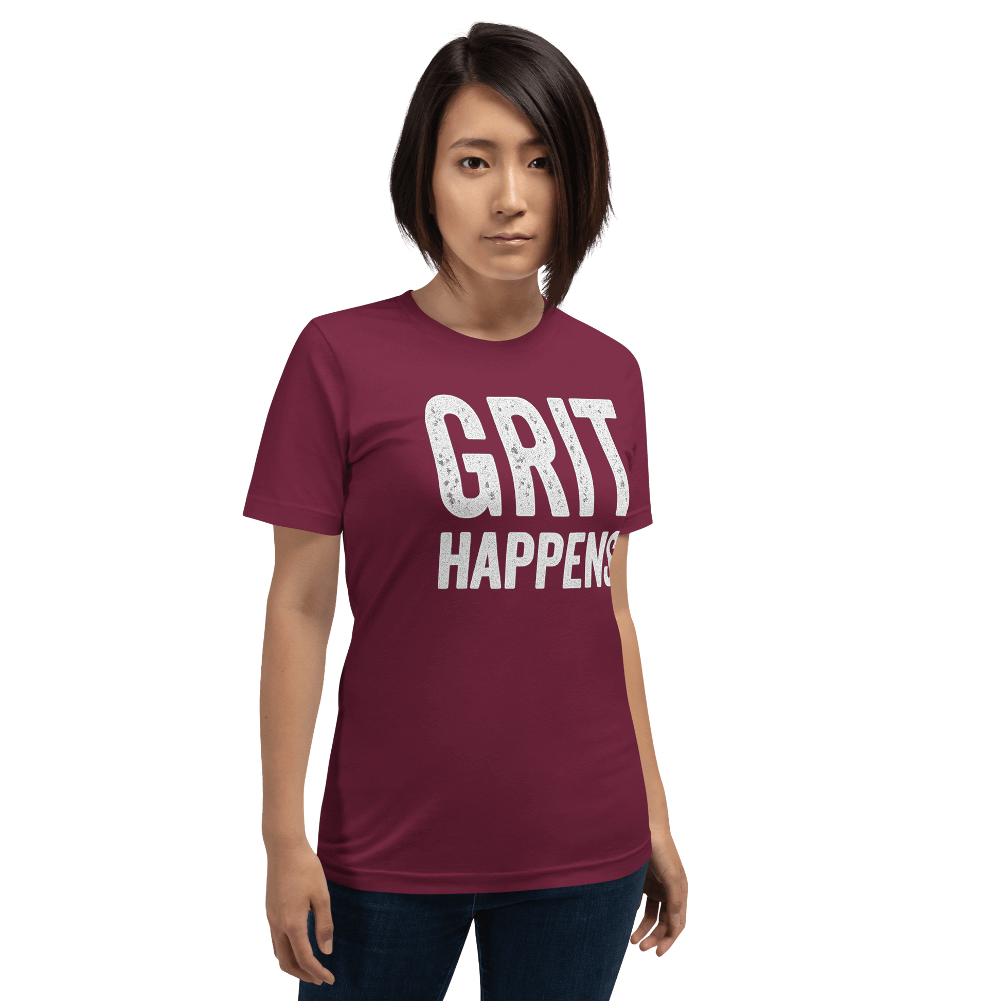 Woman stands to show the GRIT HAPPENS. unisex t-shirt in Maroon color - front veiw.