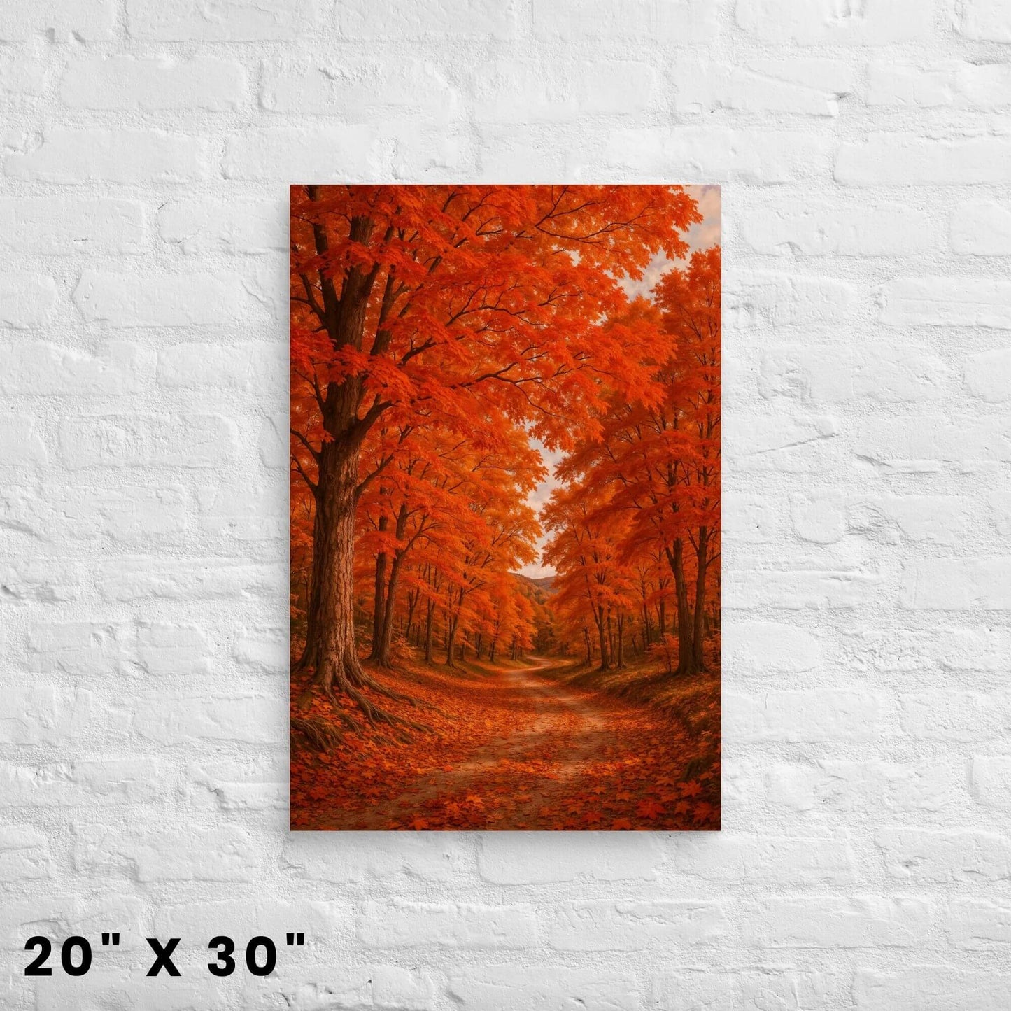 20 × 30-inch orange-leaf maple canopy canvas wall art depicting a leaf-covered country lane displayed on a clean white-brick backdrop.