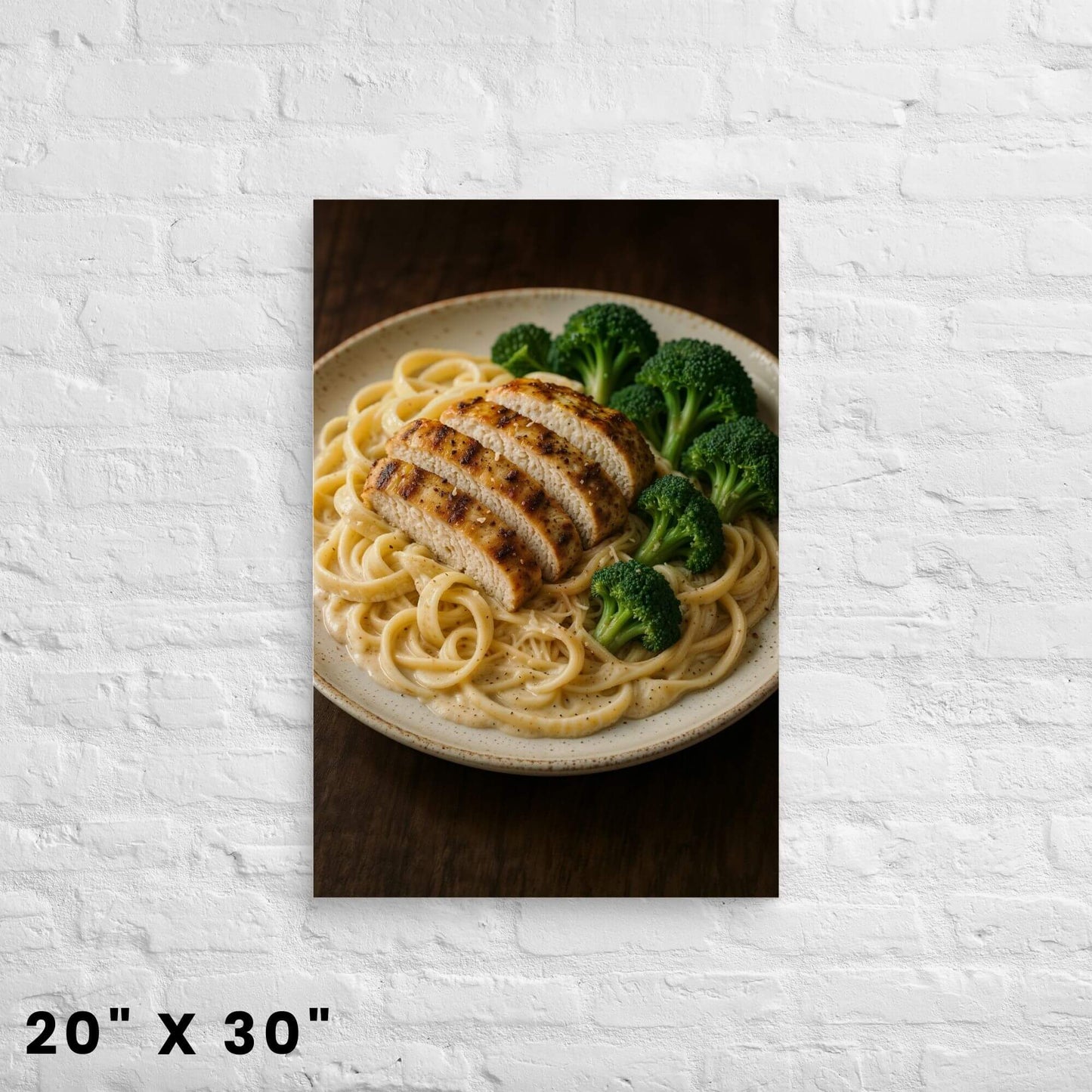 20"x30" canvas print of a mouth-watering plate of chicken Alfredo pasta and broccoli,
hanging on a white brick wall.