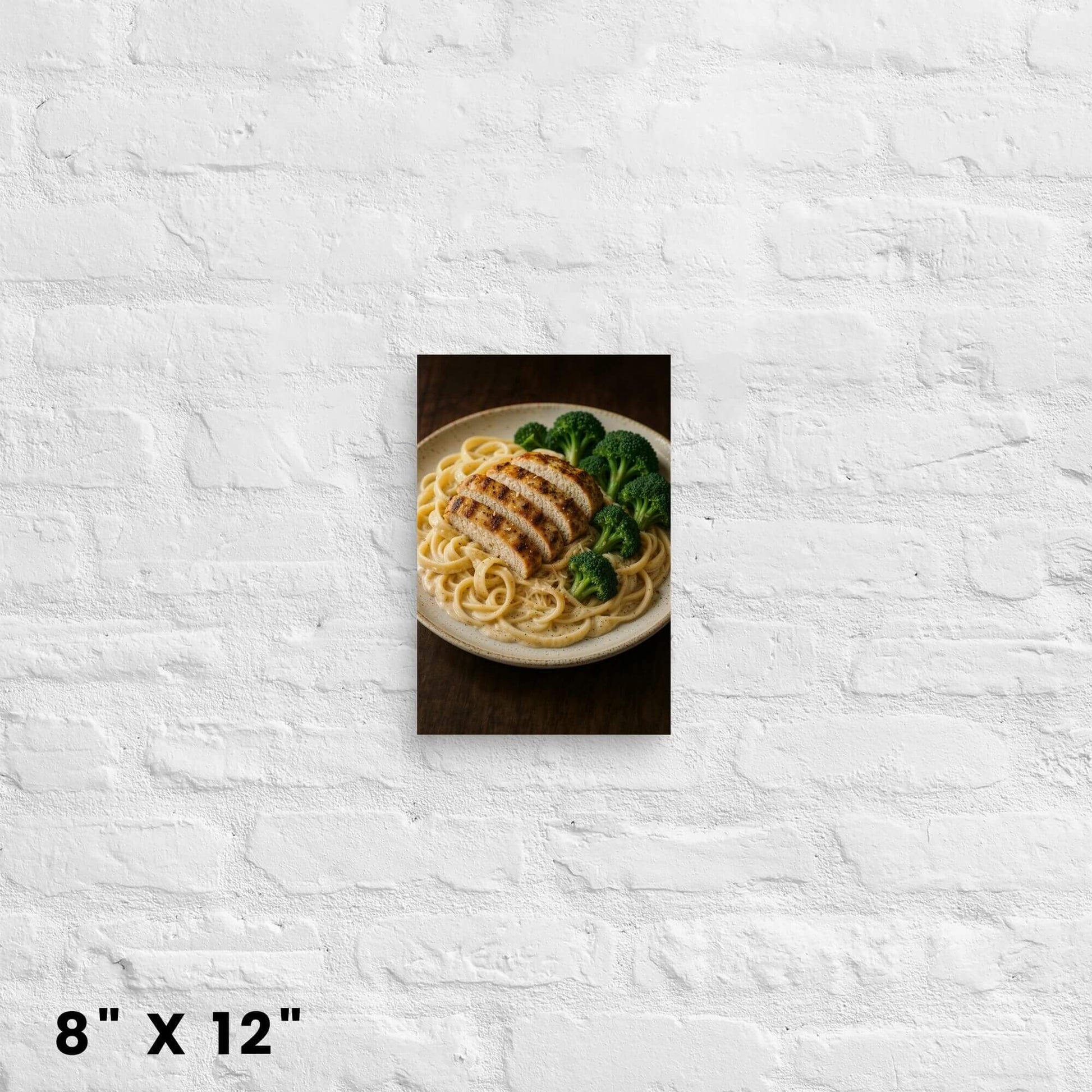 8"x12" canvas print showcasing a tempting plate of chicken Alfredo pasta and broccoli,
hanging on a white brick wall.