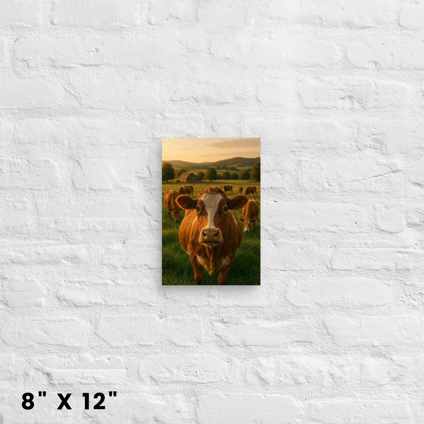 Animal art print on canvas sized 8x12 inches: a cow face in a meadow with a barn background, on a brick background.