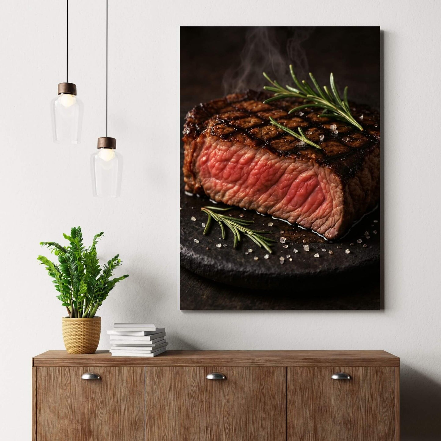 Gourmet steak canvas wall art bringing
bold foodie vibes above a modern wood sideboard with pendant lights and greenery.