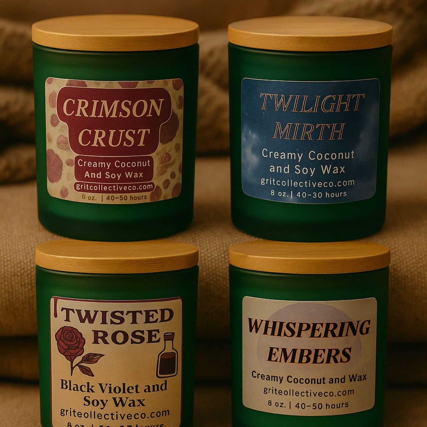 A group of four Grit Collective creamy coconut and soy wax candles in green glass jars with bamboo lids, showing the Crimson Crust, Twilight Mirth, Twisted Rose (Black Violet and Soy Wax), and Whispering Embers scents.