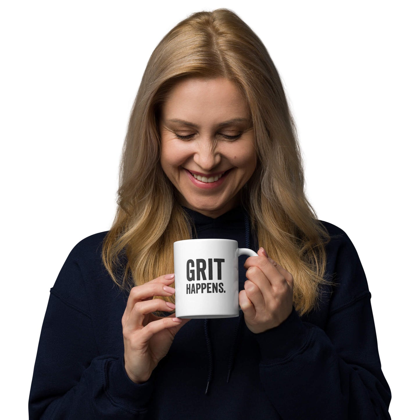 Woman smiling while holding the 11oz "Grit Happens" white ceramic coffee mug by Grit Collective.