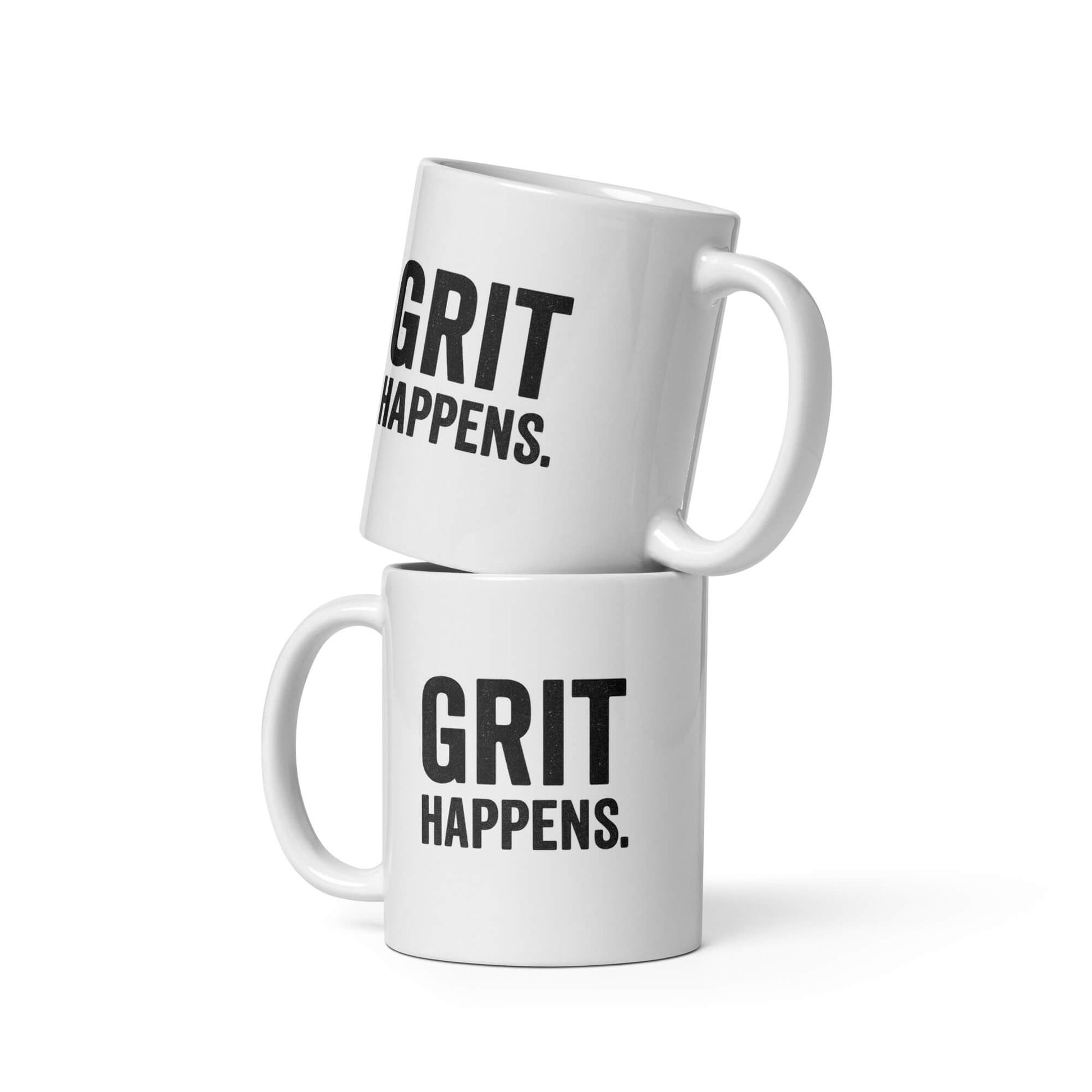 Two 11oz white ceramic mugs with the "Grit Happens" design by Grit Collective, one stacked on top of the other.