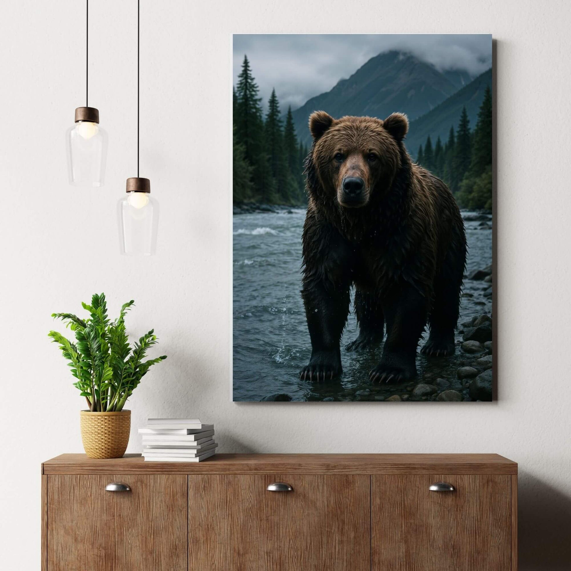 Grizzly bear mountain river canvas wall art delivering adventurous outdoor energy above a modern wood sideboard with pendant lights and greenery.
