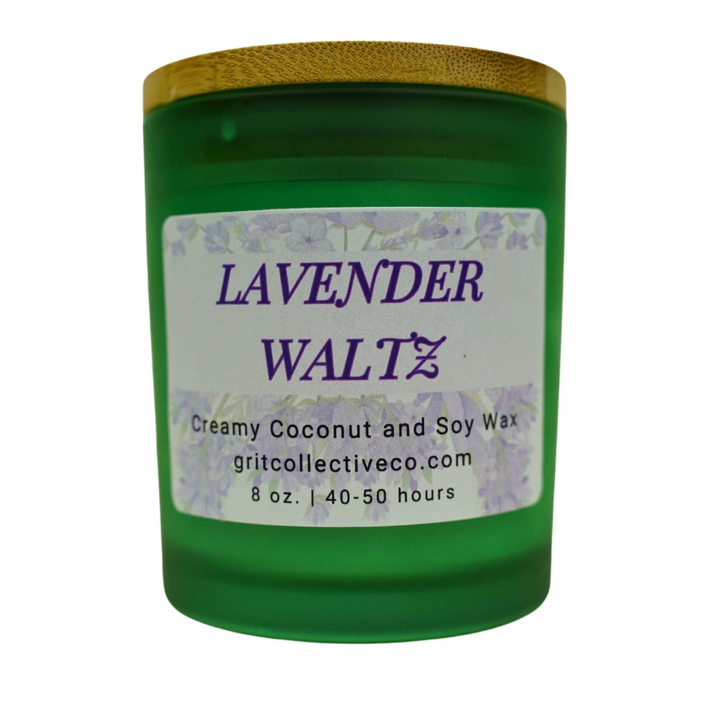 Lavender Waltz" creamy coconut and soy wax candle by Grit Collective Co. in a green glass jar with a lavender floral label and bamboo lid.