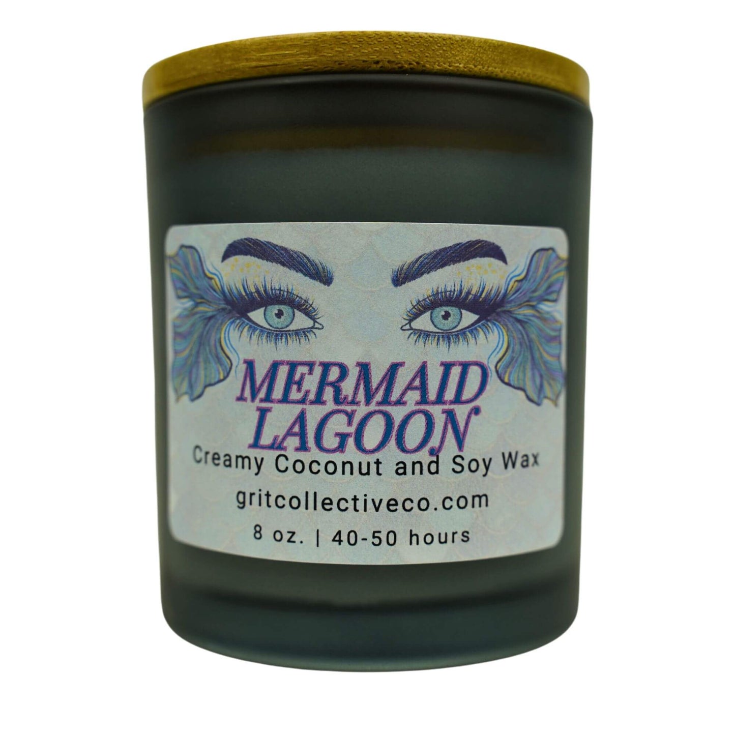 Mermaid Lagoon" creamy coconut and soy wax candle by Grit Collective Co. featuring mermaid eye artwork and a wooden lid.