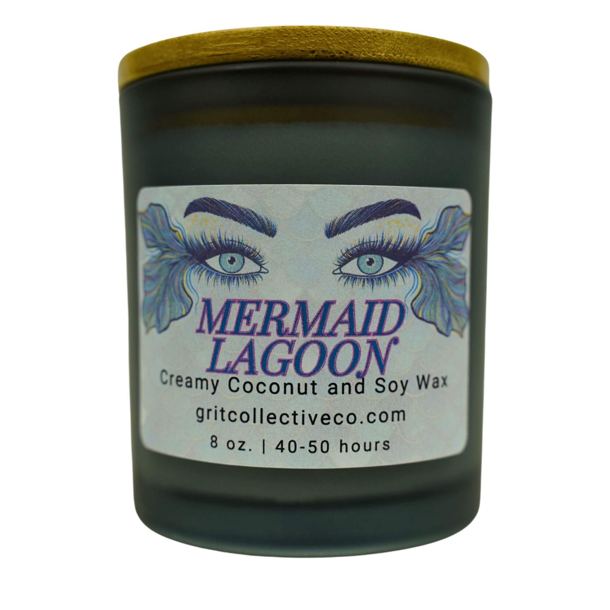Mermaid Lagoon" creamy coconut and soy wax candle by Grit Collective Co. featuring mermaid eye artwork and a wooden lid.