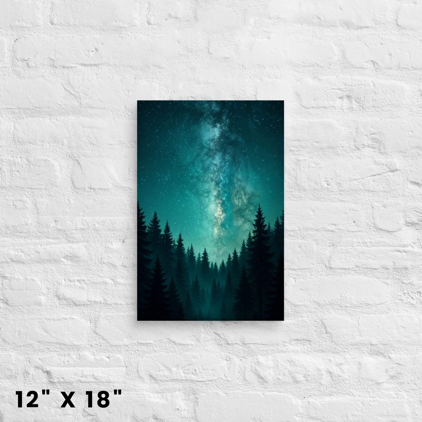12 × 18 in. teal Milky Way
night-sky canvas wall art featuring silhouetted pines on a white brick wall.