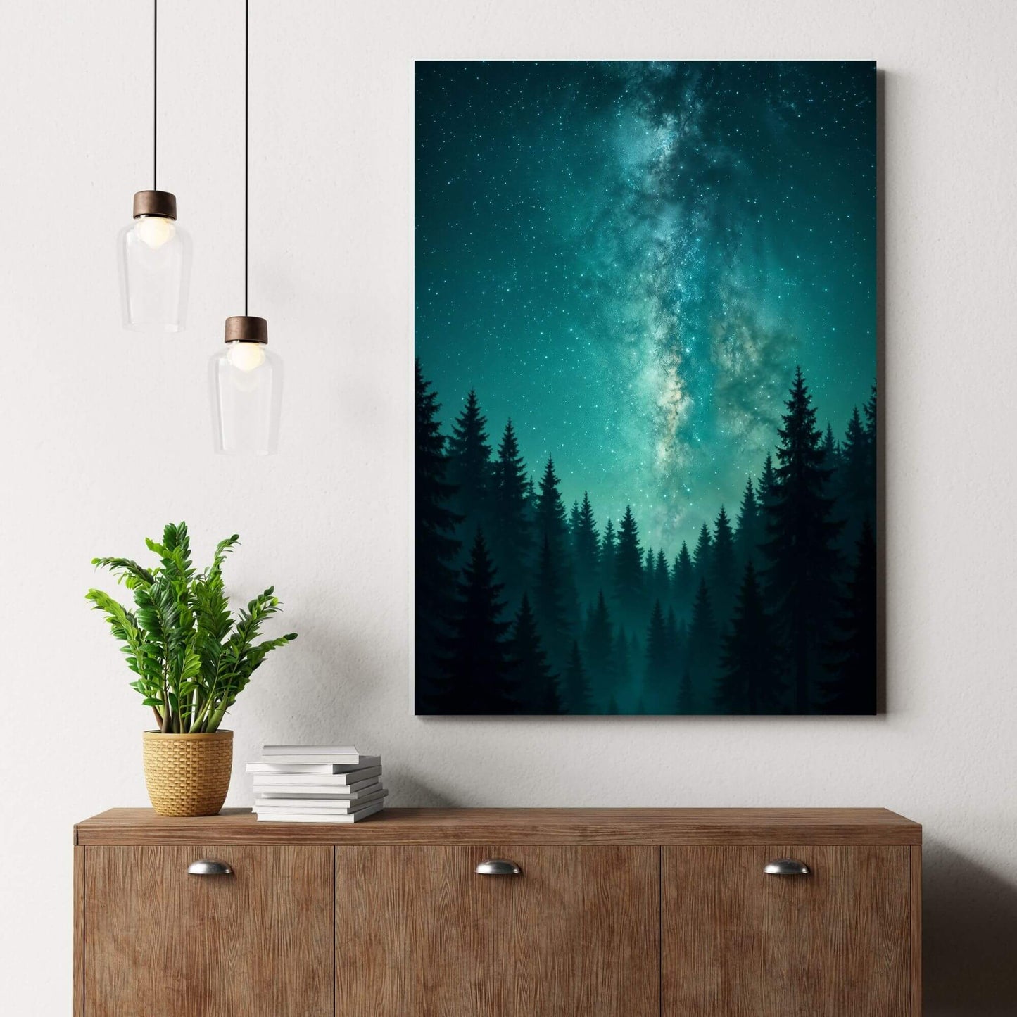 Teal Milky Way galaxy forest
canvas wall art styled above a mid-century wood sideboard with pendant lights and greenery.