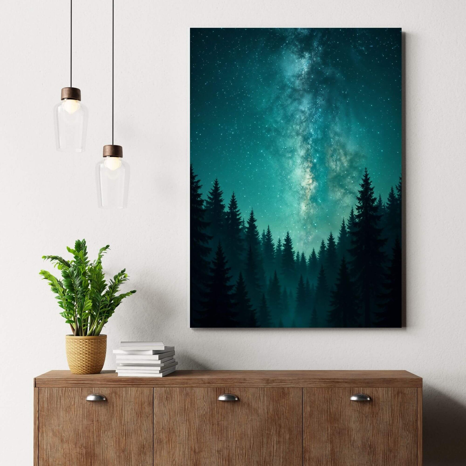 Teal Milky Way galaxy forest
canvas wall art styled above a mid-century wood sideboard with pendant lights and greenery.