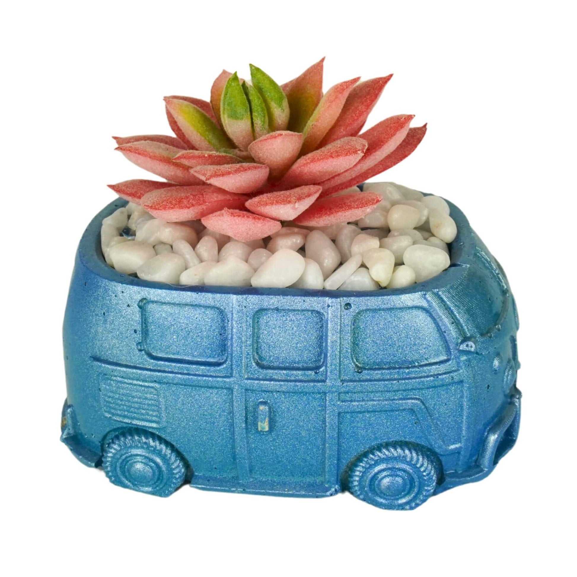Unique handmade mini retro bus concrete planter in metallic lavender with a bright pink artificial succulent and white pebbles.