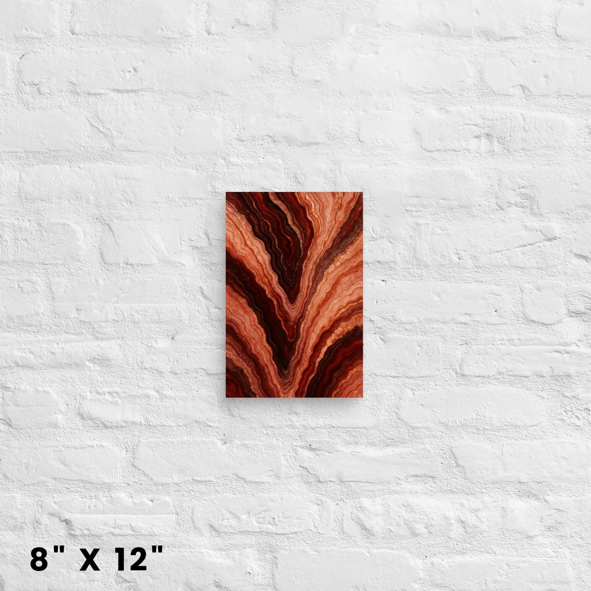 8 × 12-inch mini molten-agate abstract canvas accent delivering rich earthen warmth to a white-brick backdrop.