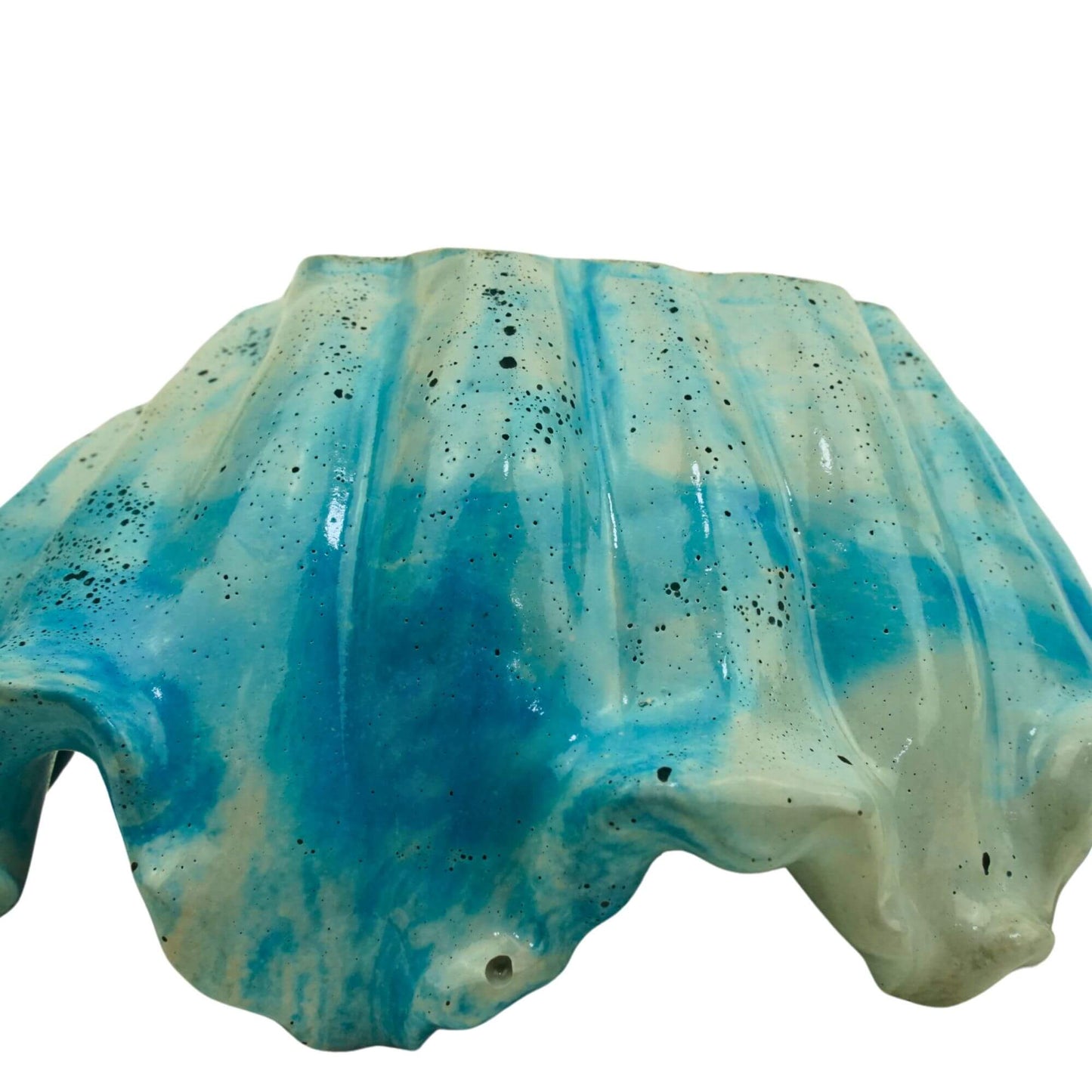 Close-up side view of a single handcrafted concrete Ocean Bowl in blue tide color.