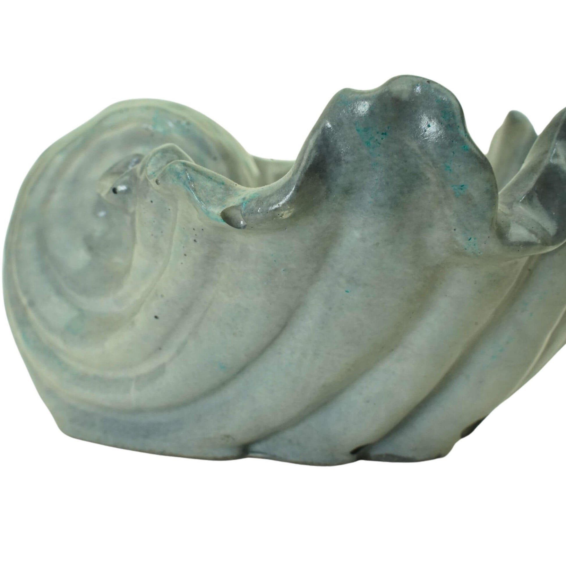Close-up detail of the swirl pattern on a gray or blue tide handcrafted concrete Ocean Bowl.