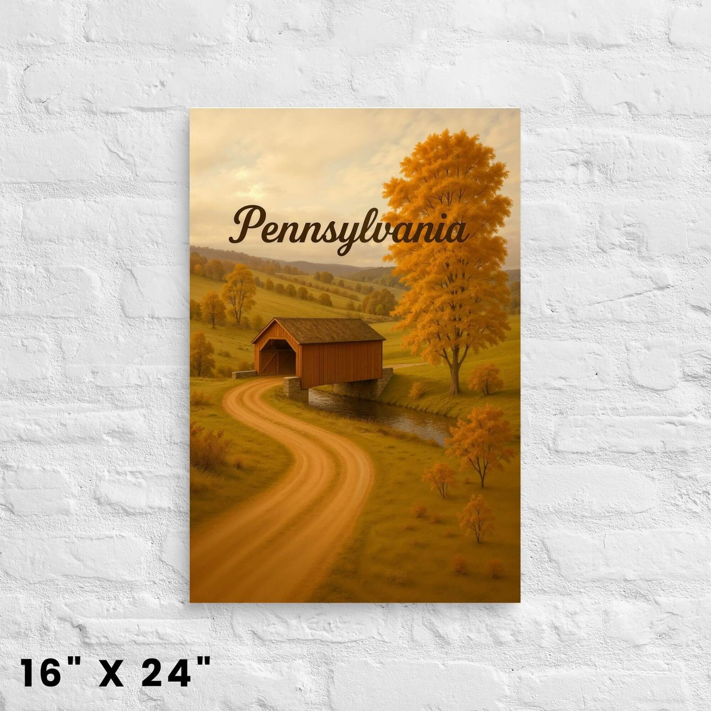 16"x24" canvas print featuring an autumn Pennsylvania landscape with a covered bridge,
displayed on a white brick wall.