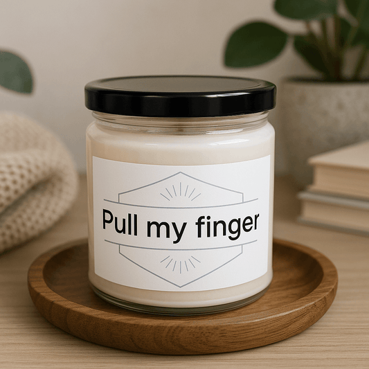 Pull my finger" funny soy candle in a glass jar on a wooden tray.