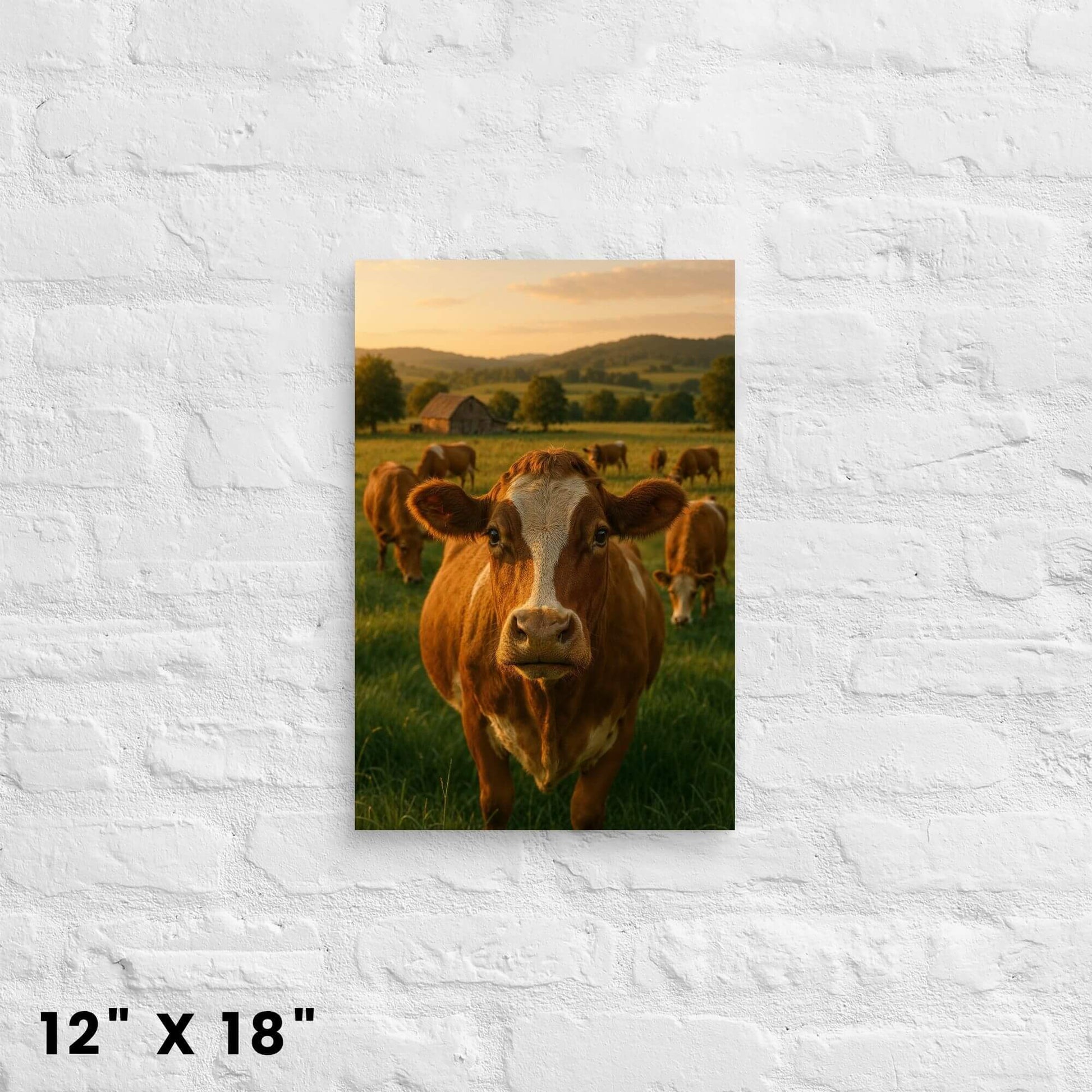 Animal art print on canvas sized 12x18 inches: a cow face in a meadow with a barn background, on a brick background.