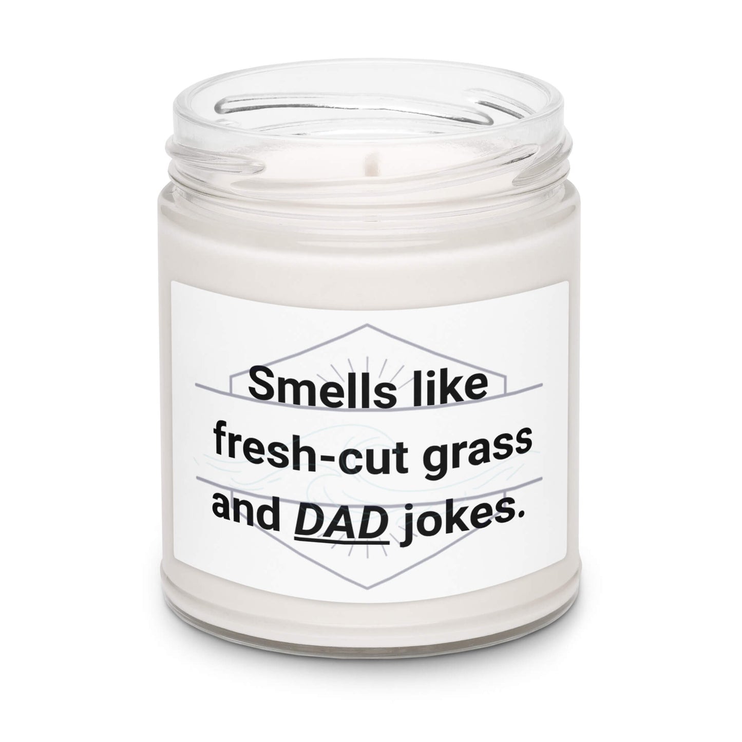 Angled view of "Smells like fresh-cut grass and DAD jokes" soy candle in a 9oz glass jar.