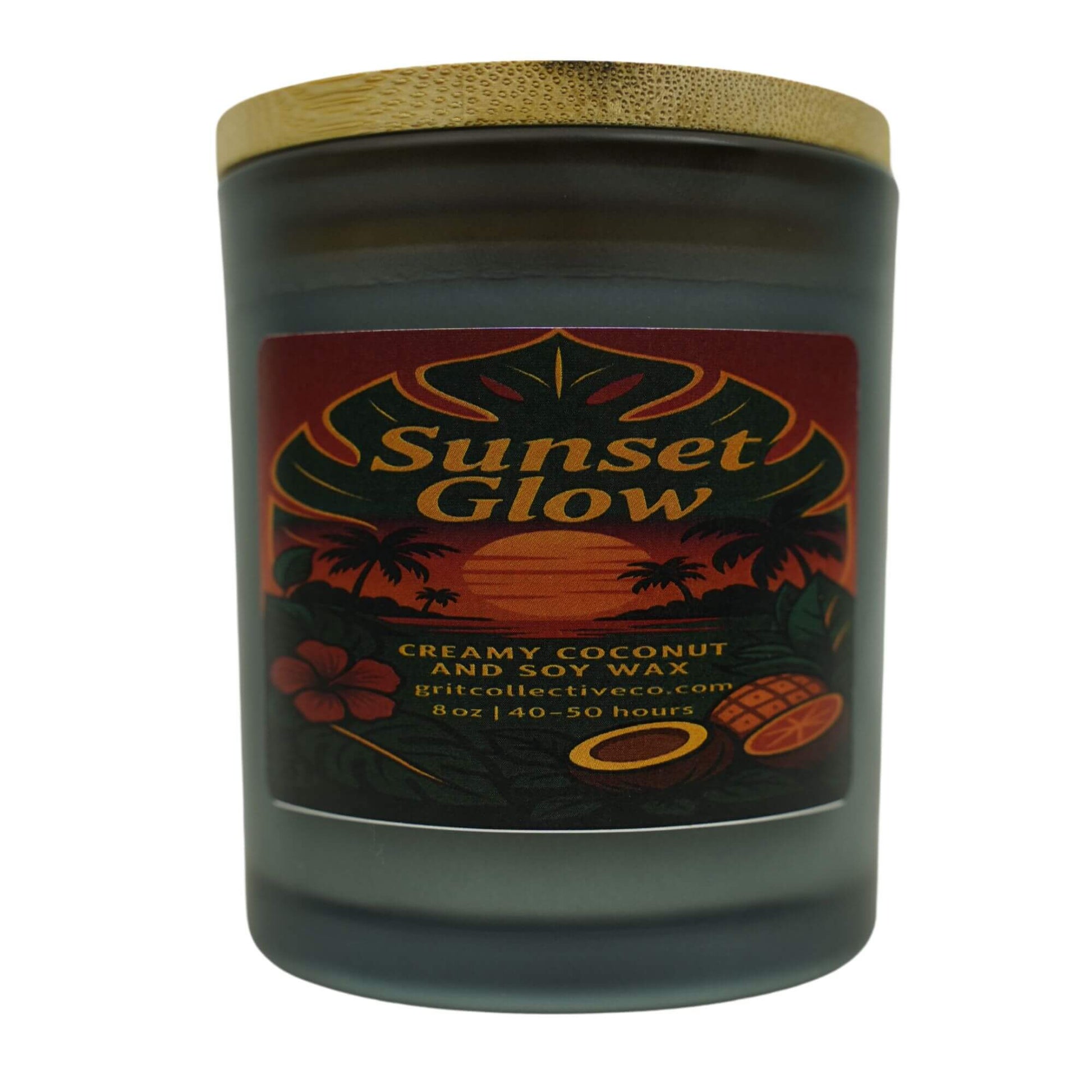 Sunset Glow" creamy coconut and soy wax candle by Grit Collective Co. featuring tropical sunset artwork and a wooden lid.