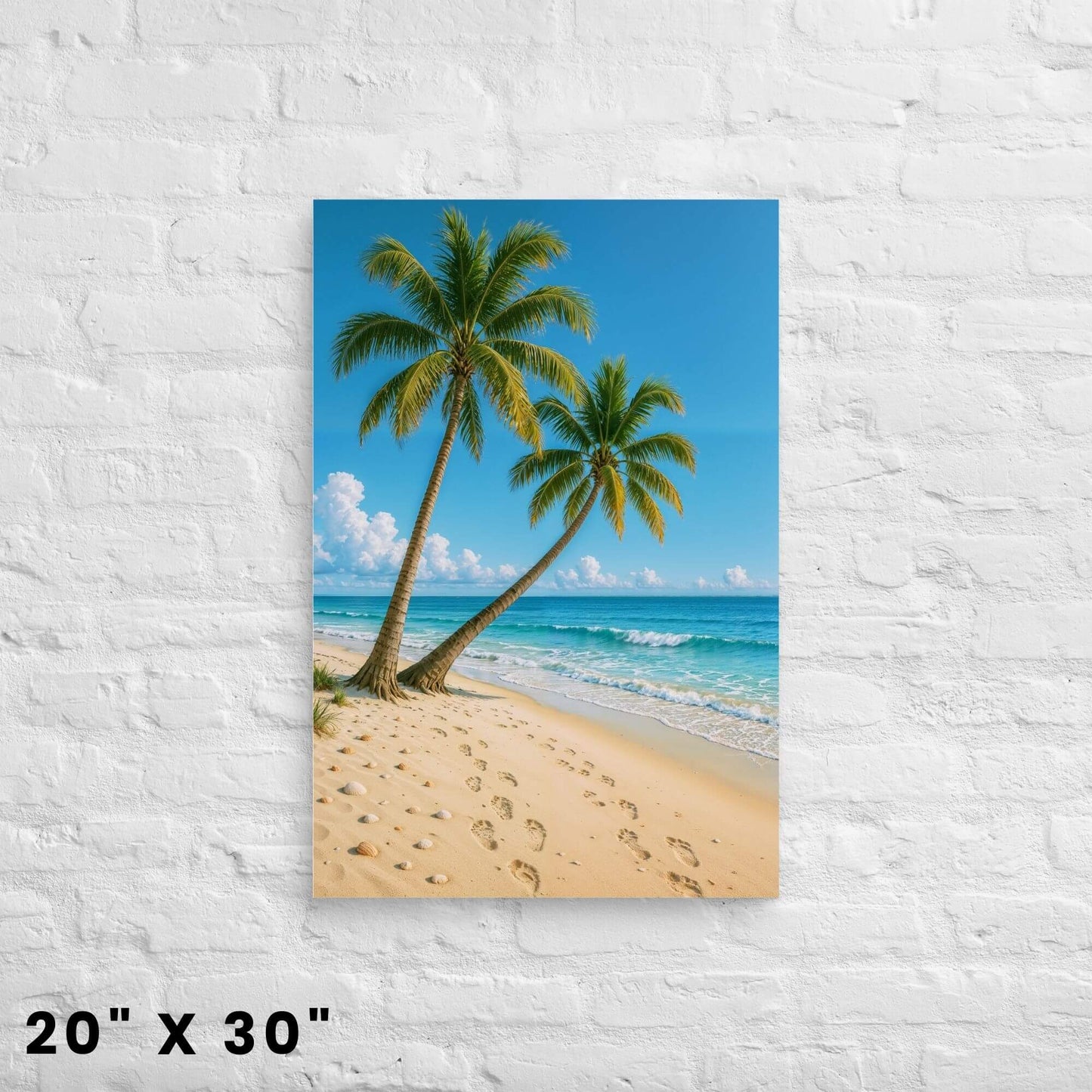 20 × 30-inch sunny shoreline canvas print with twin palm trees and gentle waves on a clean white-brick wall.