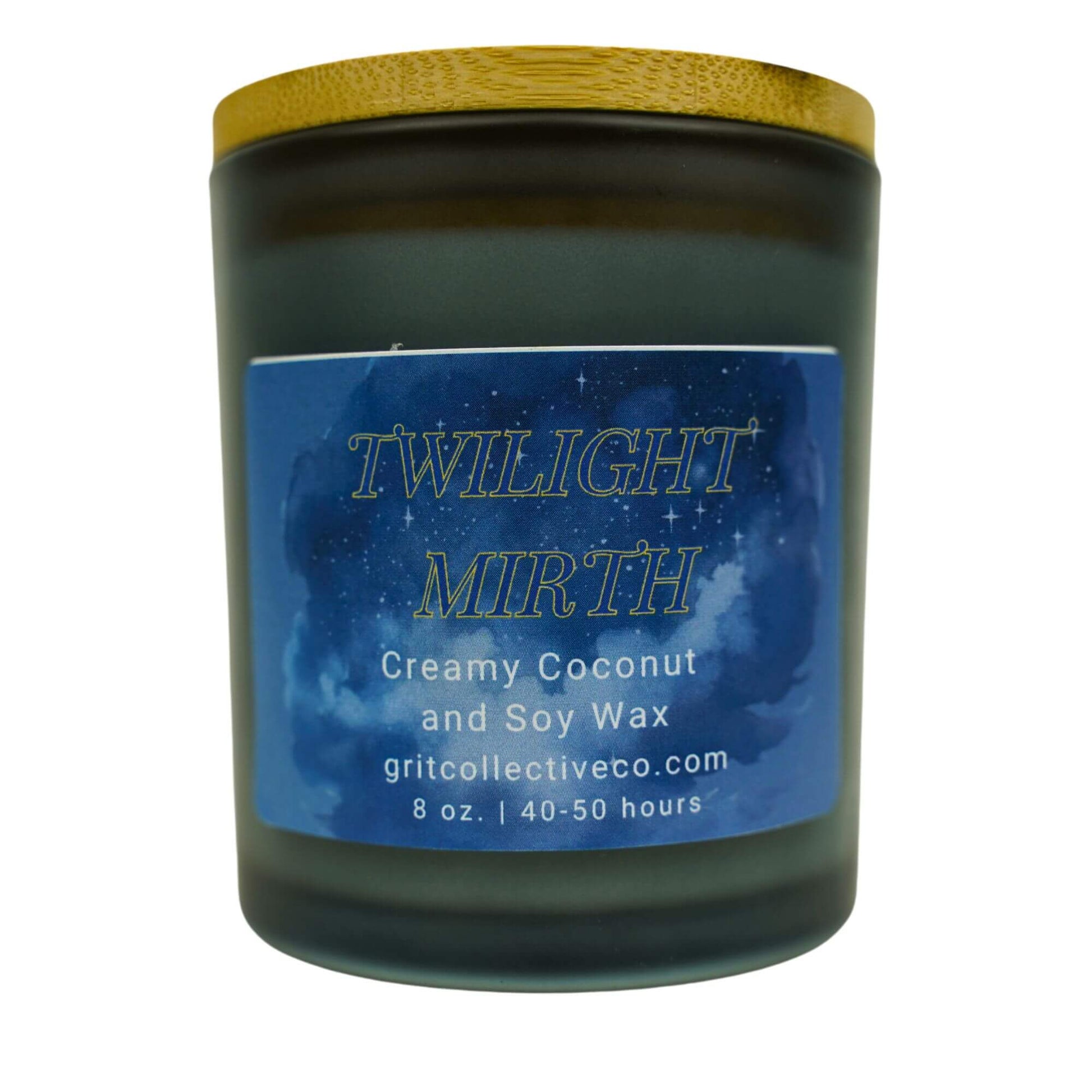Twilight Mirth" creamy coconut and soy wax candle by Grit Collective Co. with a starry night sky label and wooden lid.