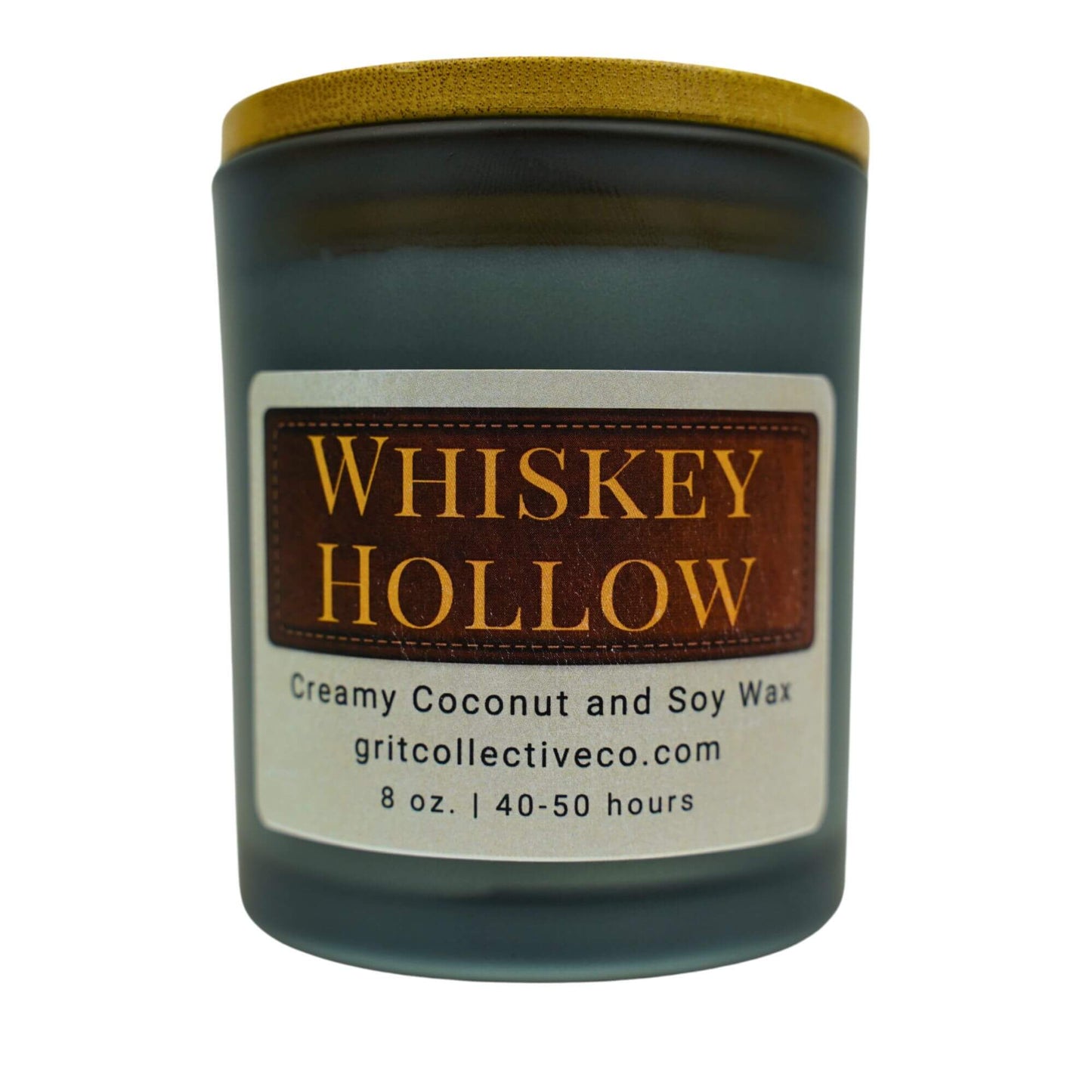 Whiskey Hollow" creamy coconut and soy wax candle by Grit Collective Co. with a rustic label design and wooden lid.