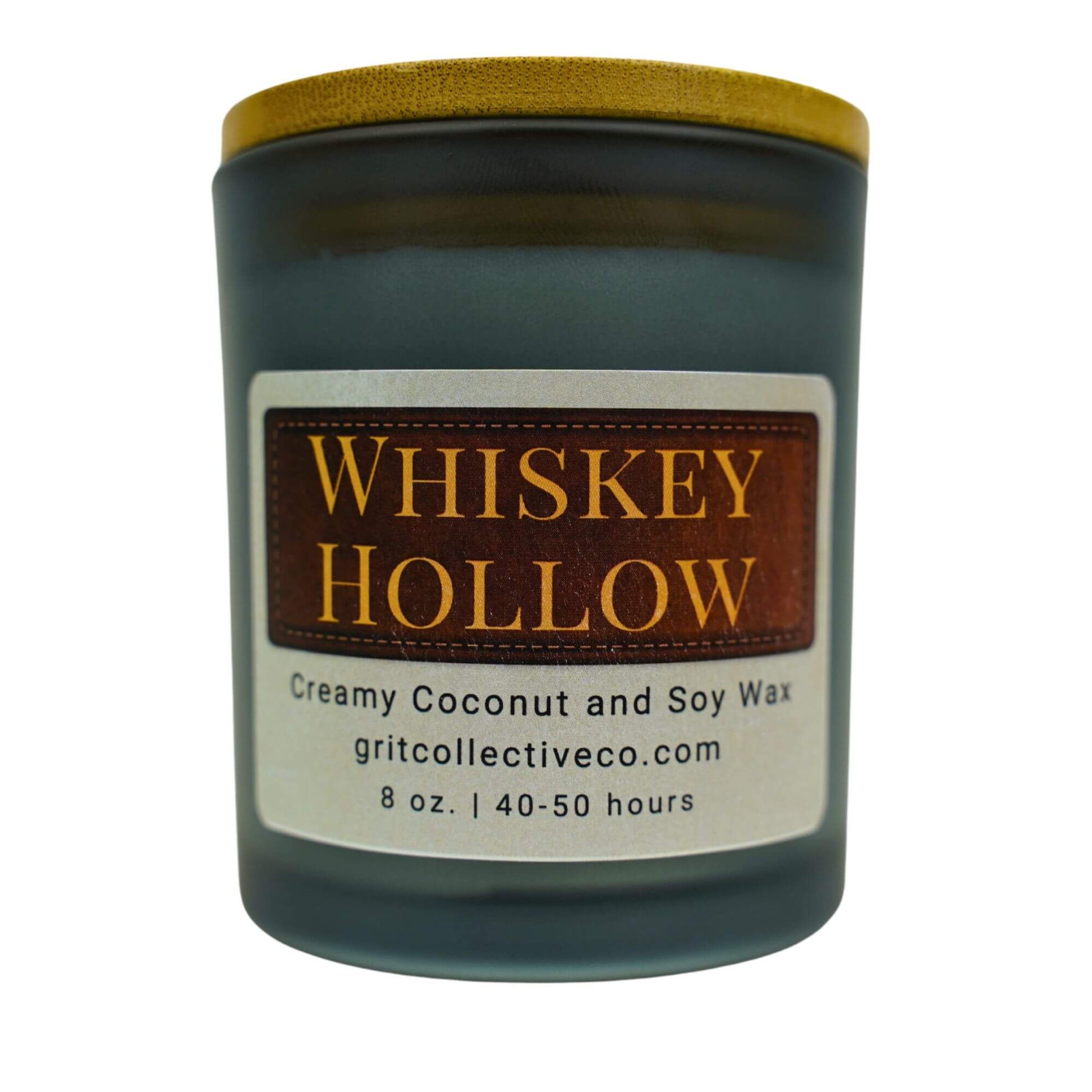 Whiskey Hollow" creamy coconut and soy wax candle by Grit Collective Co. with a rustic label design and wooden lid.