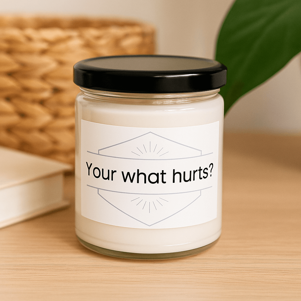 Your what hurts?" quote candle on a light wooden table with a woven basket in the background.