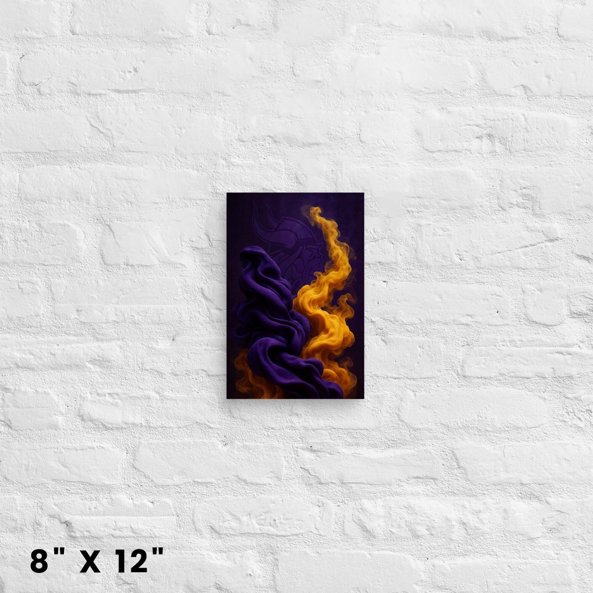 8"x12" abstract art canvas print in purple and gold, hanging on a white brick wall.