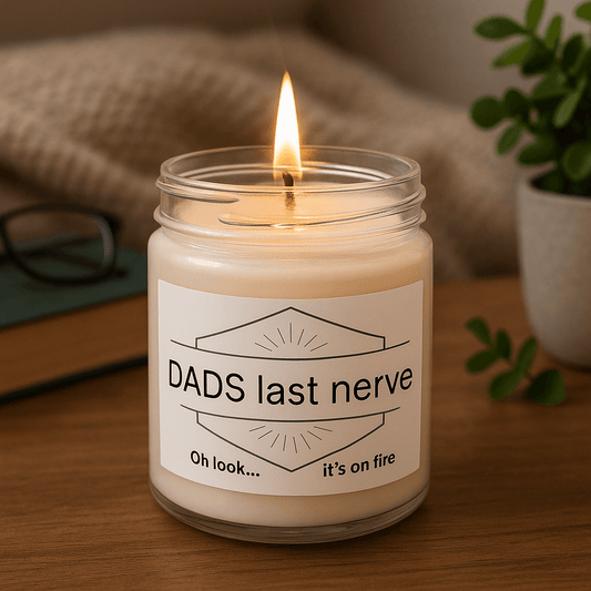 Dad's Last Nerve Oh look it's on fire" candle on a table.