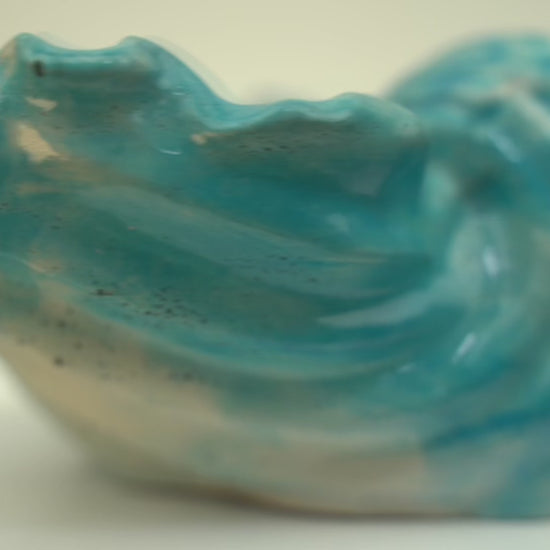 Single handcrafted concrete Ocean Bowl in a blue and black swirl color, a coastal charm dish.Single handcrafted concrete Ocean Bowl in a green and black swirl color, a coastal charm dish.