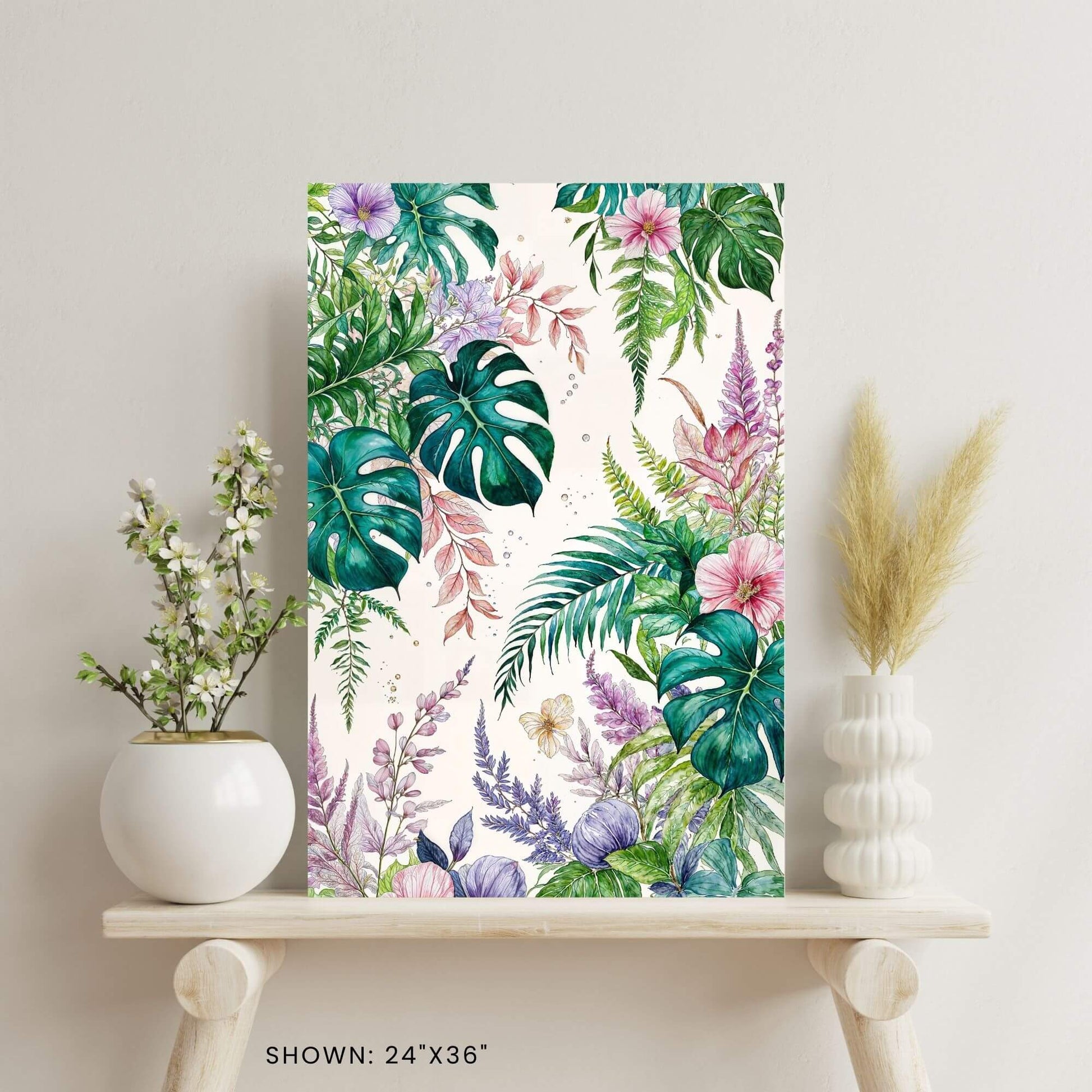 24"x36" canvas print featuring a watercolor illustration of lush tropical leaves and colorful flowers, shown on a decorative shelf.